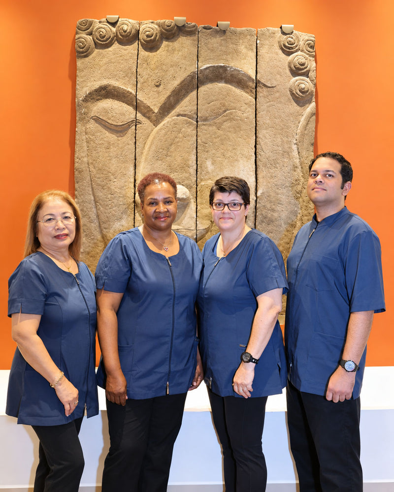 Team of professionals wearing navy Ekita uniforms